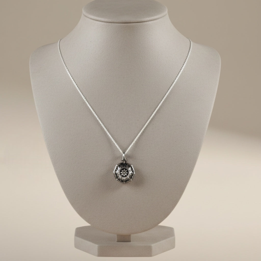 Bedrock Rose Petite Mandala Necklace, sterling silver pendant with intricate celestial compass design.