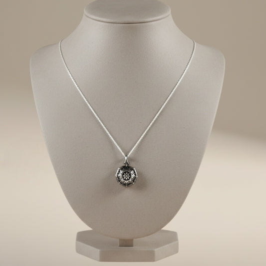 Bedrock Rose Petite Mandala Necklace, sterling silver pendant with intricate celestial compass design.