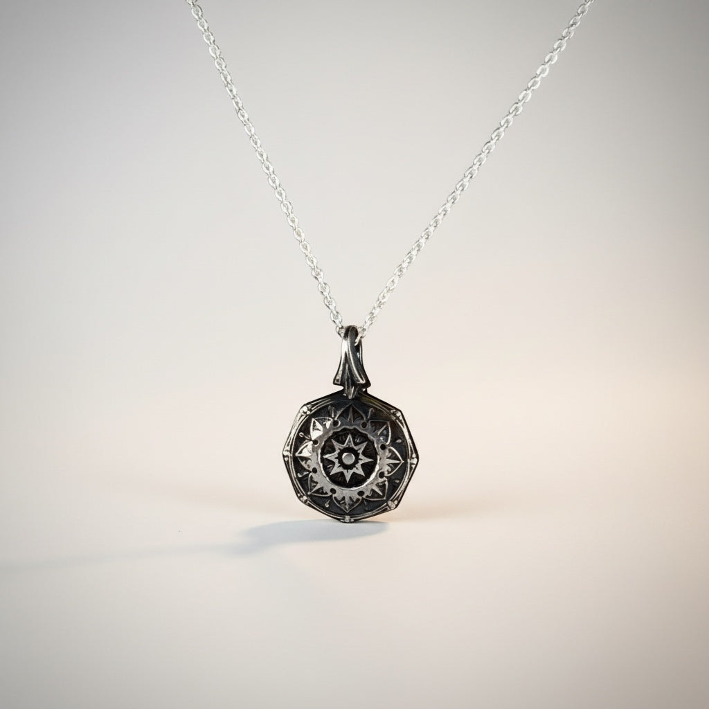 Bedrock Rose petite silver mandala pendant necklace with intricate spiritual design.
