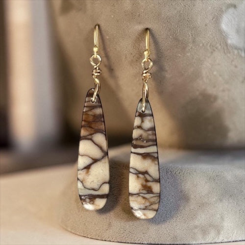 Bedrock Rose Picasso teardrop dangle earrings with cream and brown marbled stone and gold-plated wire-wrapped hooks.