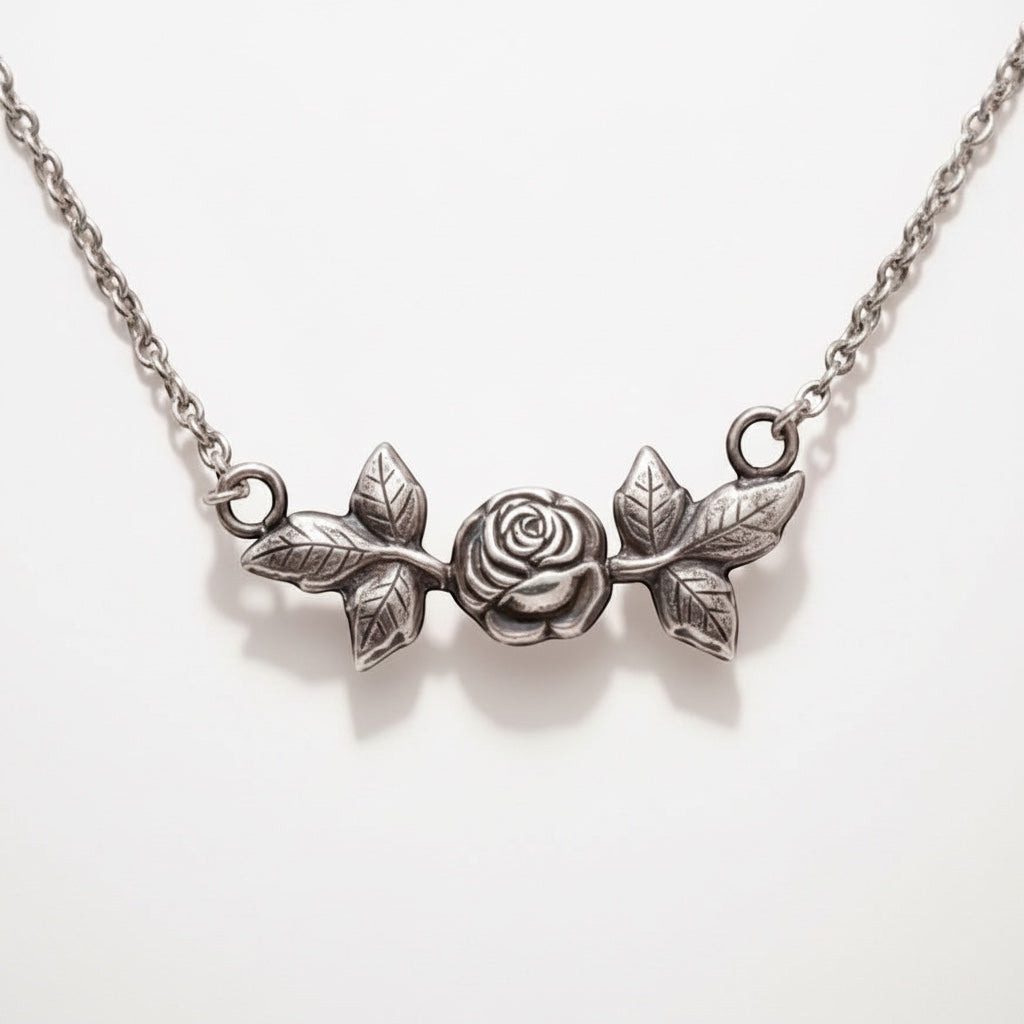 Bedrock Rose sterling silver necklace with rosebud and leaf design. Pendant is 2" wide.