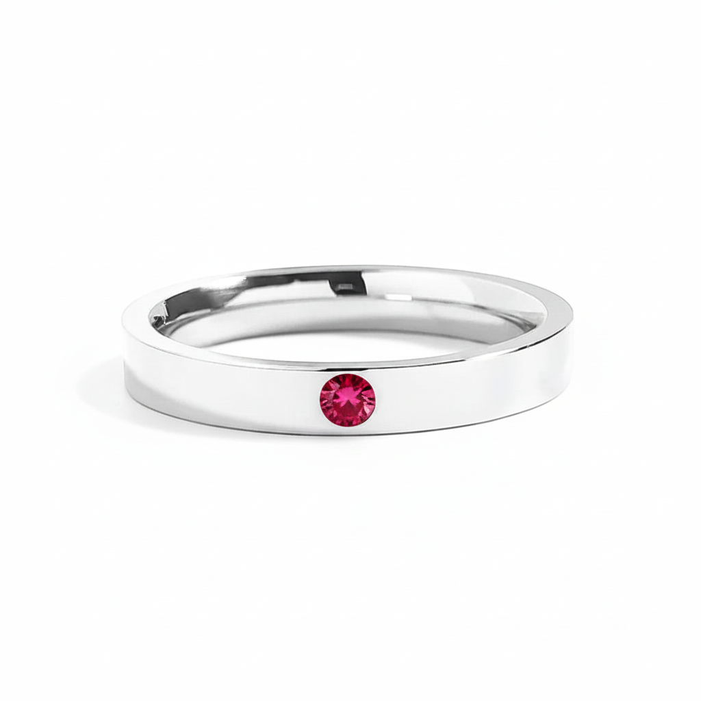Bedrock Rose personalized stainless steel stackable ring with a 3mm round red birthstone set in a 4mm band.