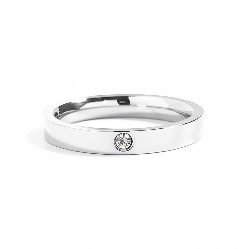 Bedrock Rose silver stainless steel stackable ring with a single 3mm pave birthstone, 4mm wide band.