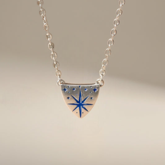Bedrock Rose silver compass rose medallion pendant necklace on a dainty sterling silver cable chain.