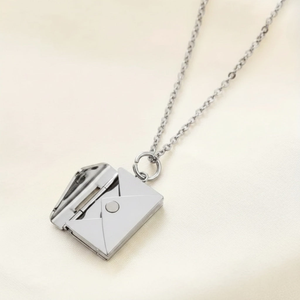 Bedrock Rose silver envelope pendant necklace with a hidden message compartment on a delicate cable chain.