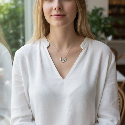 Bedrock Rose Sterling Silver floral crescent pendant necklace with a 16" chain, inspired by the solar eclipse.