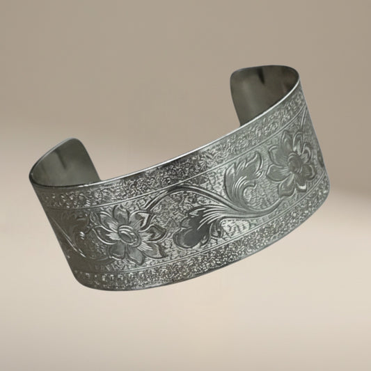 Bedrock Rose sterling silver-plated cuff bracelet featuring an intricate engraved floral flourish design.