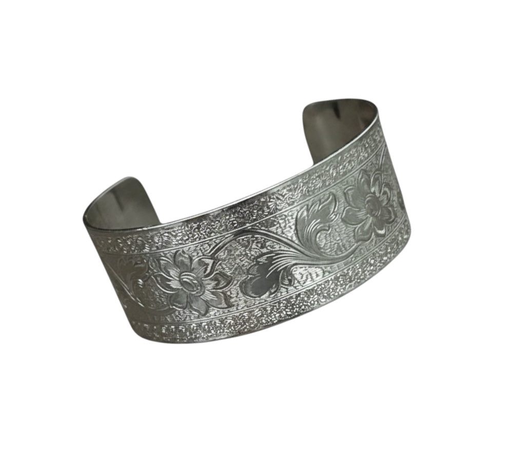 Bedrock Rose sterling silver-plated cuff bracelet featuring an intricate engraved floral flourish design.