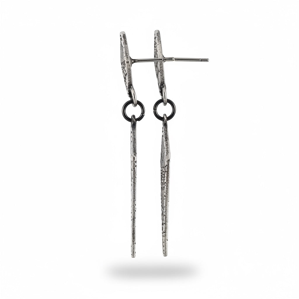 Bedrock Rose fine silver Totem drop earrings featuring elongated diamond shapes with intricate geometric textures.