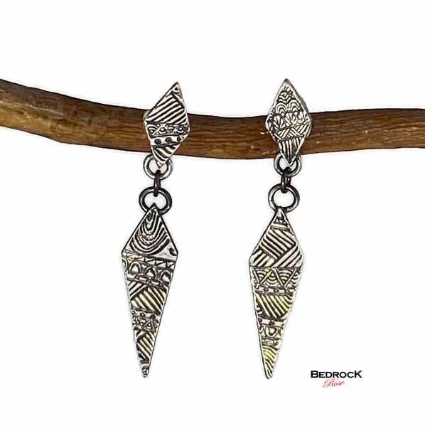 Bedrock Rose fine silver drop earrings featuring hand-stamped geometric quilt patterns in an elongated diamond shape.