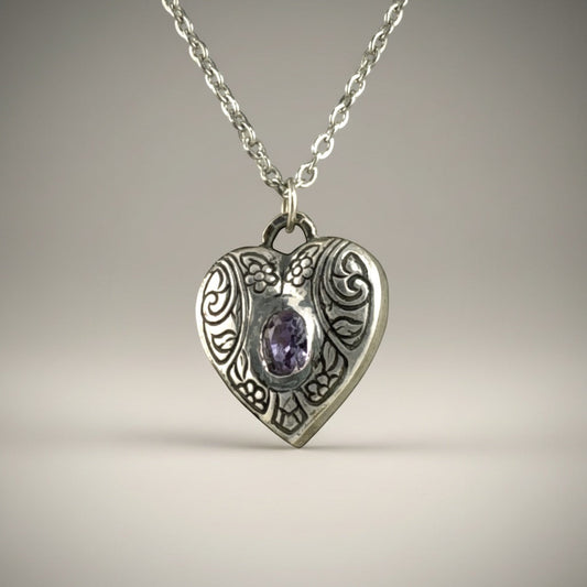 Bedrock Rose silver heart pendant with engraved floral details and a purple amethyst CZ stone.