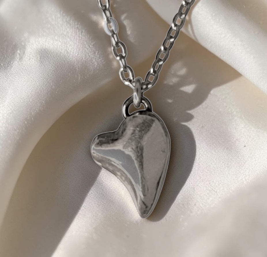 Bedrock Rose fine silver puffed heart pendant on a faceted stainless steel chain