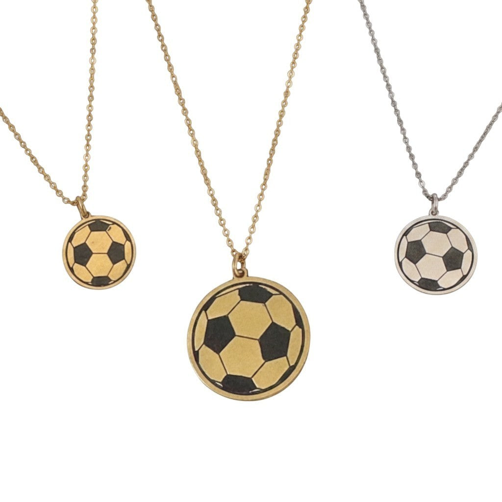 Bedrock Rose soccer ball pendant necklaces in brass and sterling silver with laser-engraved details on steel chains.