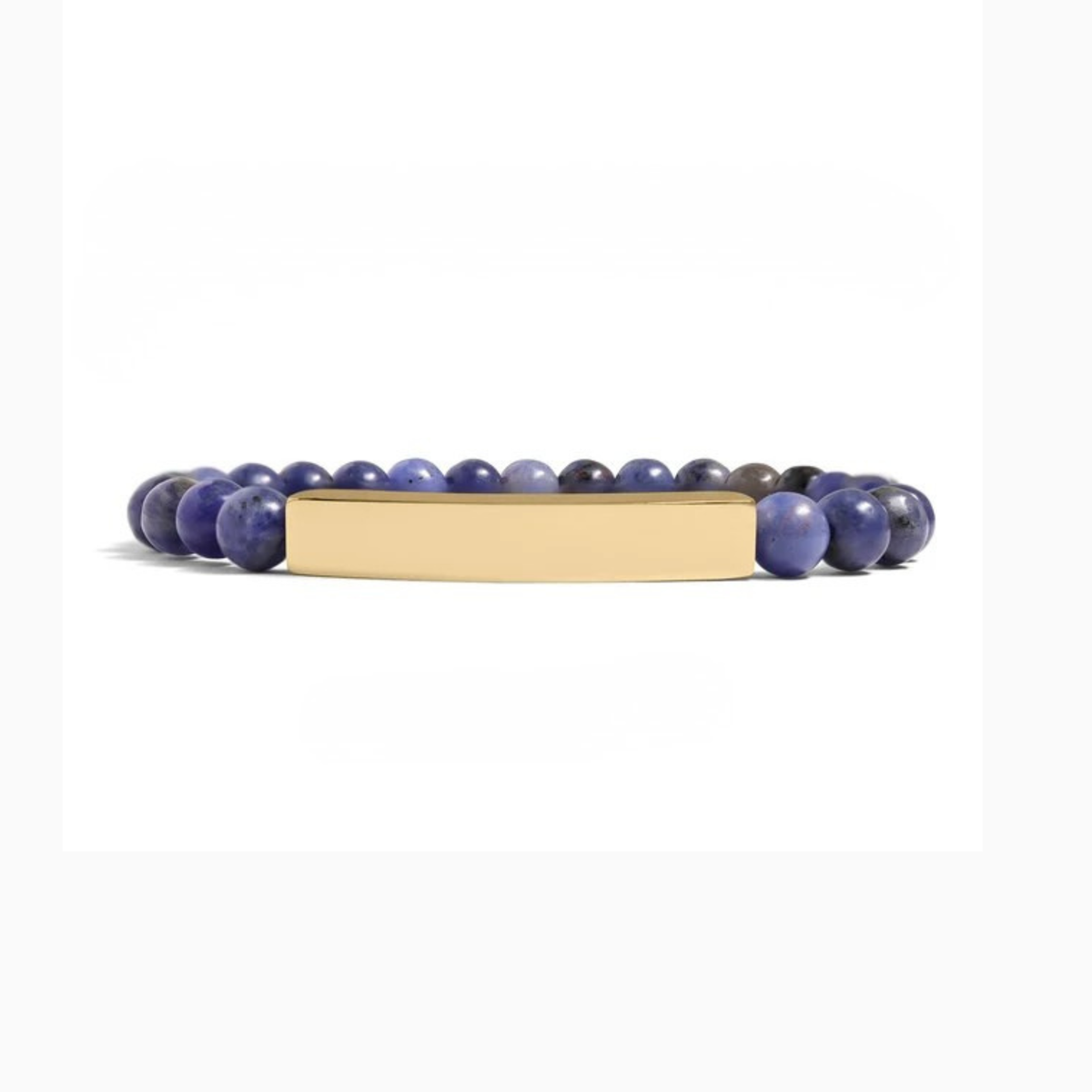 Bedrock Rose stretch bracelet with blue sodalite beads and a gold-tone curved engravable bar on a white background.