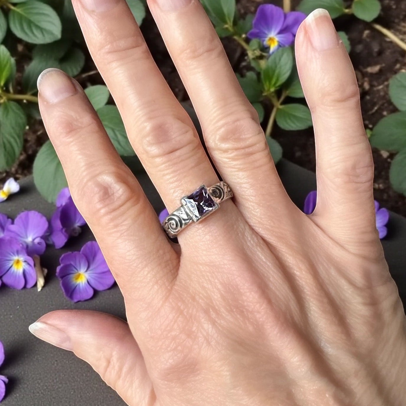 Bedrock Rose square amethyst nano gem ring with ornate sterling silver scrollwork band worn on a hand