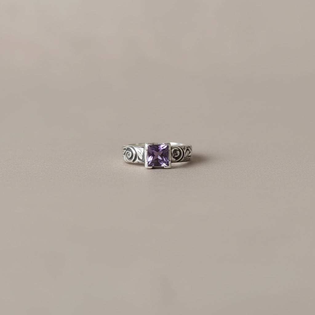 Bedrock Rose square amethyst nano gem ring with ornate scrollwork on an oxidized sterling silver band.