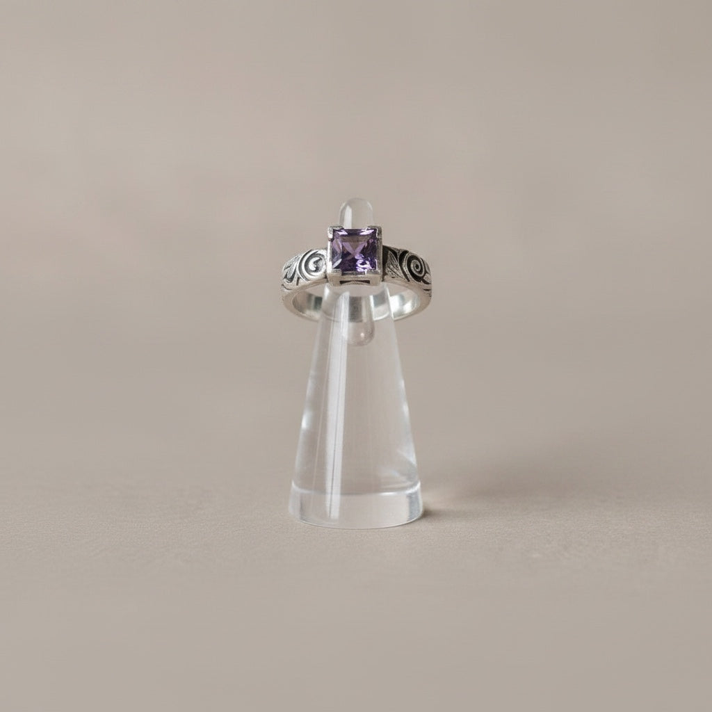 Bedrock Rose square amethyst nano gem ring with ornate scrollwork on an oxidized sterling silver band.