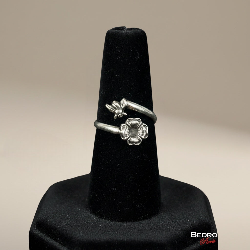 Bedrock Rose antique sterling silver wrap ring featuring a detailed bee and blossom, oxidized patina, adjustable size 6.
