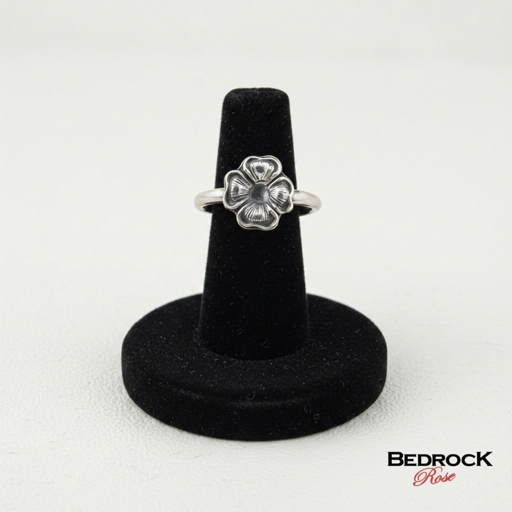 Bedrock Rose sterling silver ring with a dainty four-petal blossom design. Minimalist botanical band, size 5.25.