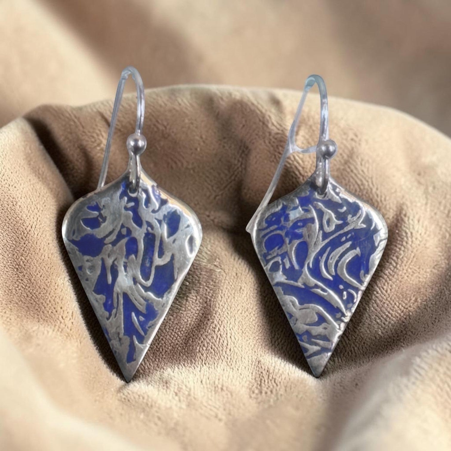 Bedrock Rose sterling silver dangle earrings with shield shape, blue abstract branch texture, and dark patina finish.