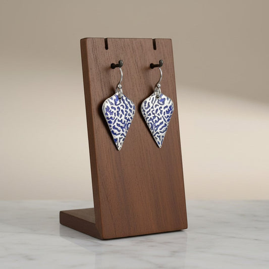 Bedrock Rose sterling silver shield dangle earrings featuring a blue coral-inspired texture and patina finish.