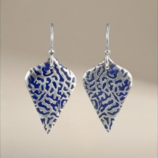 Bedrock Rose sterling silver shield earrings with organic blue coral texture and patina finish.