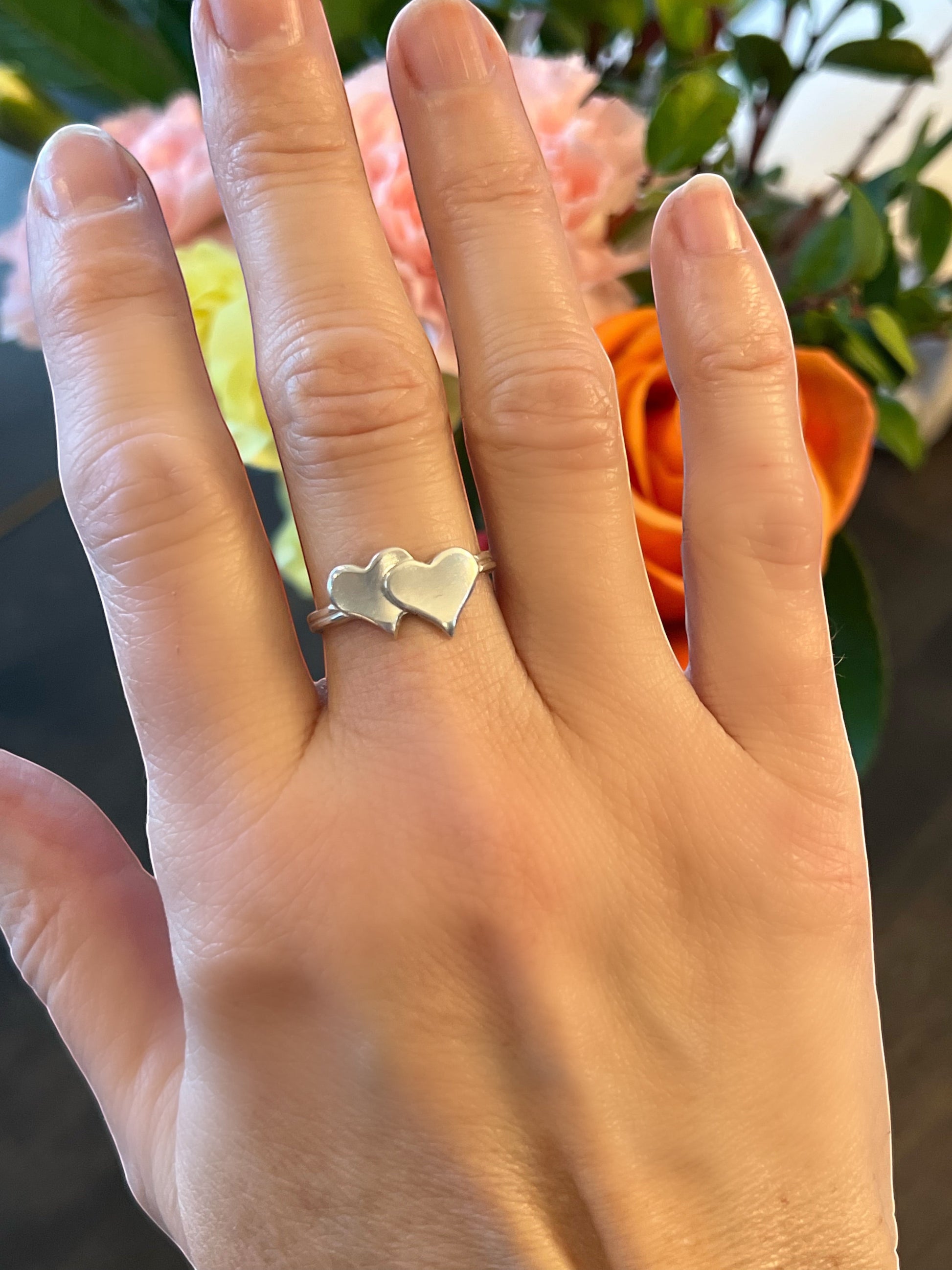 Bedrock Rose sterling silver ring with two interlinked hearts, size 7.5.