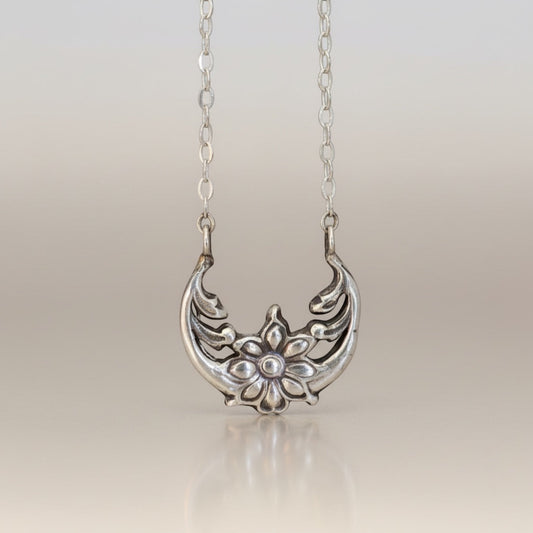 Bedrock Rose sterling silver floral crescent pendant necklace with moonflower motif, inspired by solar eclipse.