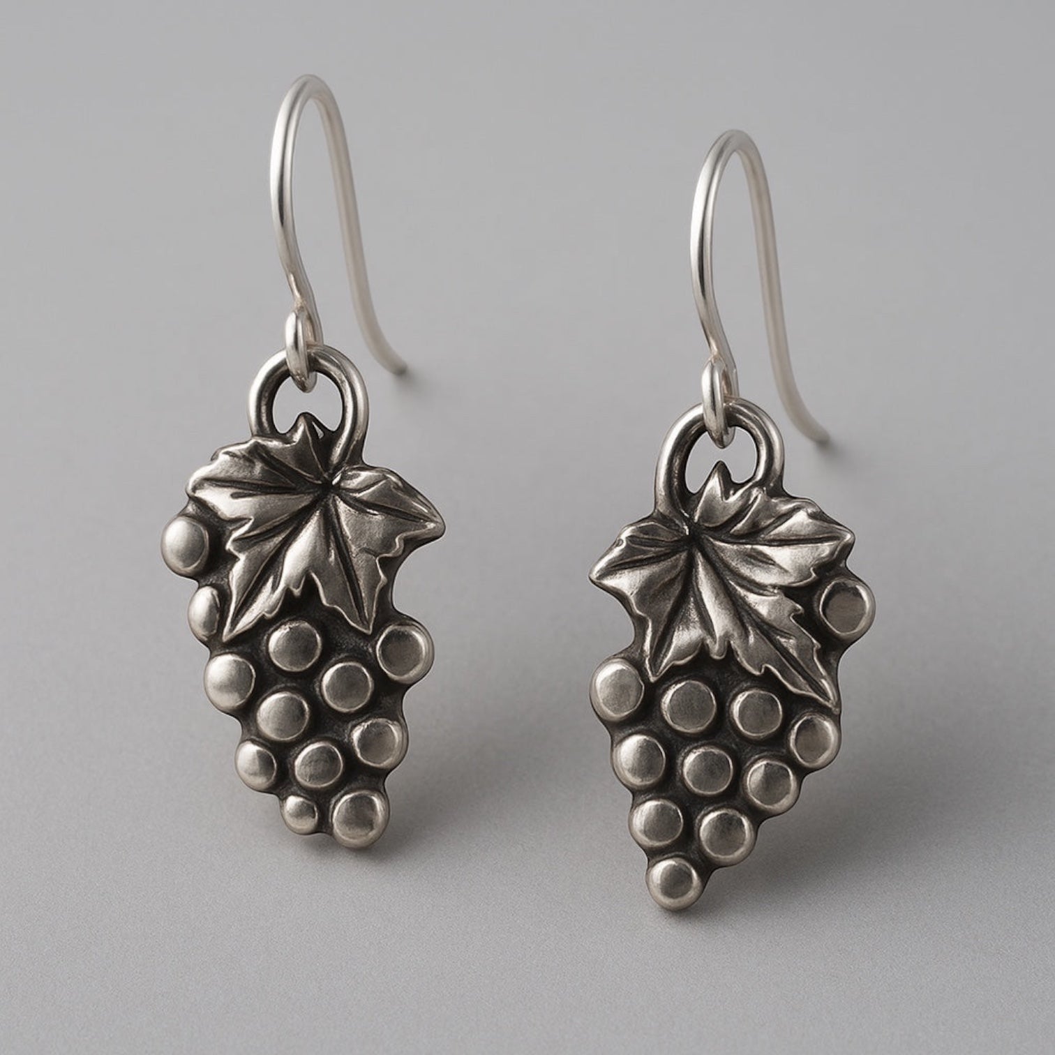 Bedrock Rose sterling silver grape bunch dangle earrings with leaf detail. Playful design.