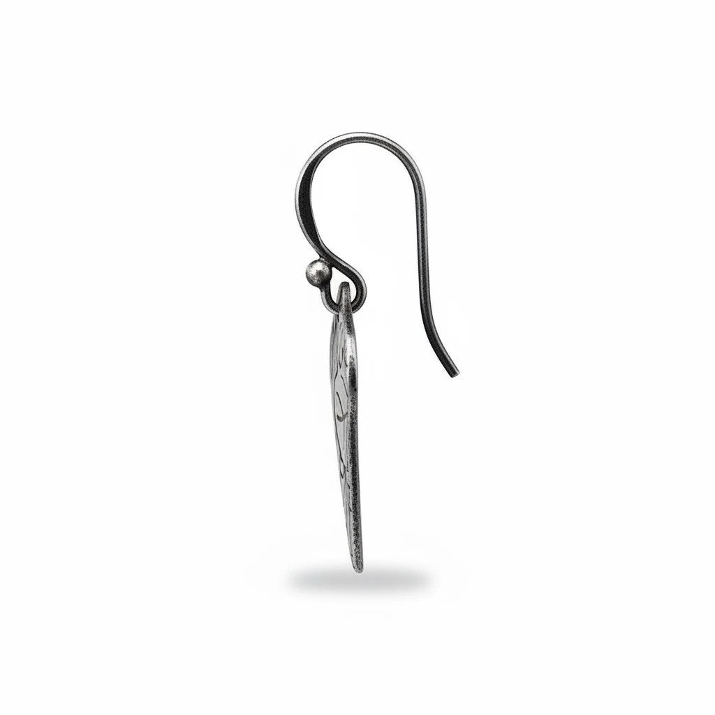 Bedrock Rose sterling silver dangle earrings with shield shape, lotus texture, and dark oxidized patina finish.