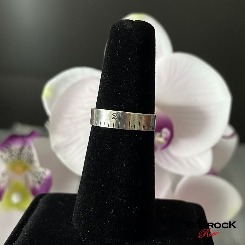 Bedrock Rose sterling silver band ring with hand-milled ruler markings and oxidized detail. Size 9.25.
