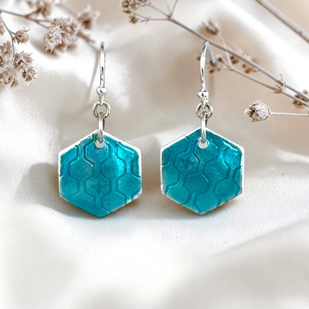 Bedrock Rose hexagon dangle earrings in fine silver with turquoise vitreous enamel and a honeycomb texture.