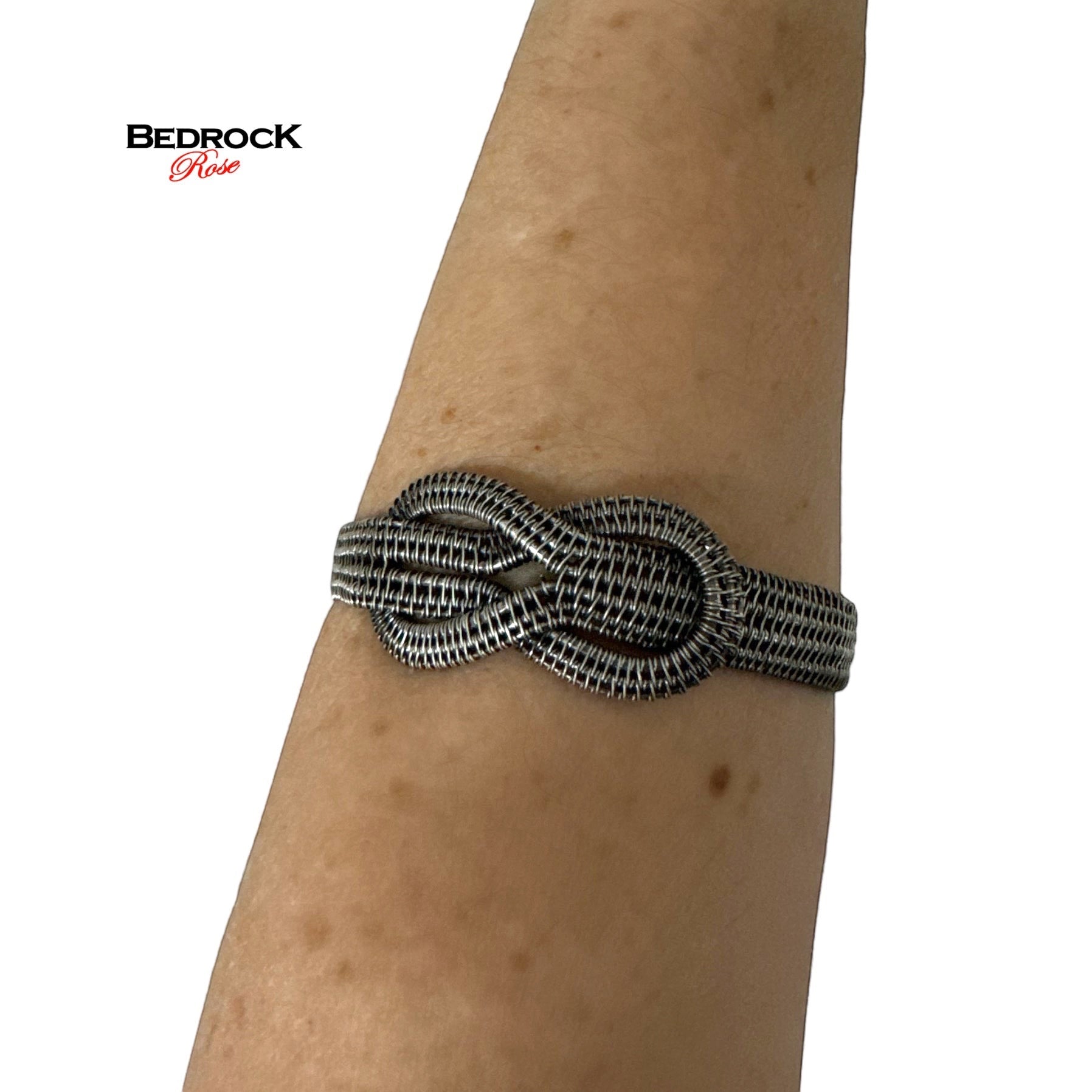 Bedrock Rose woven sterling silver infinity symbol bracelet worn on a wrist