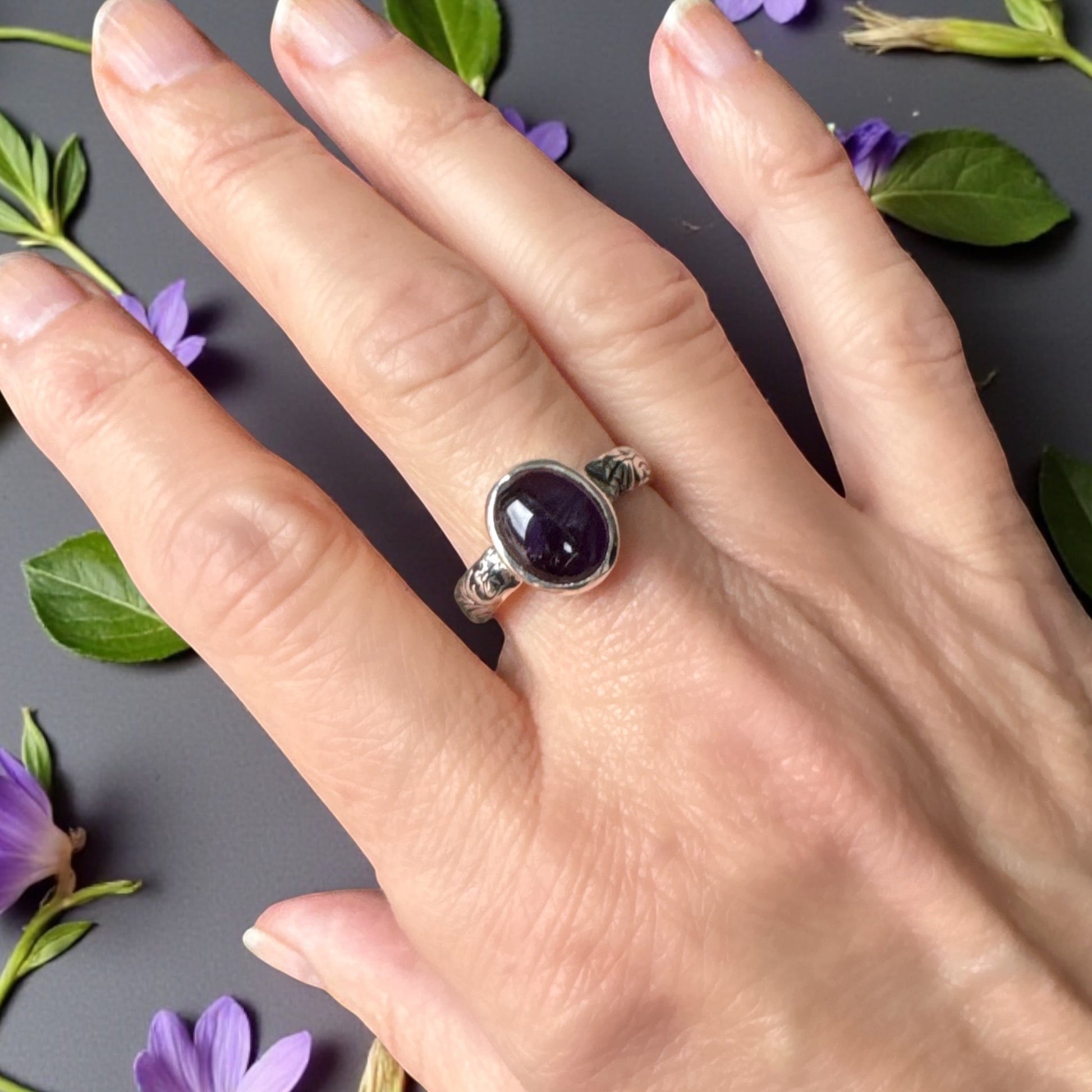 Amethyst cabochon ring with floral band