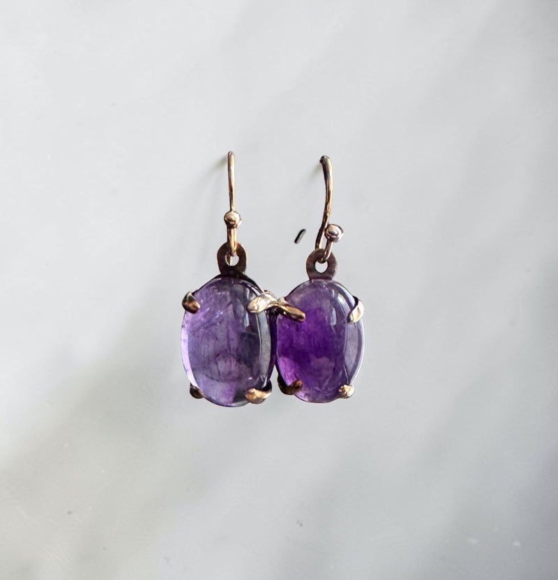 Bedrock Rose oval amethyst prong set dangle earrings with rose gold hooks.