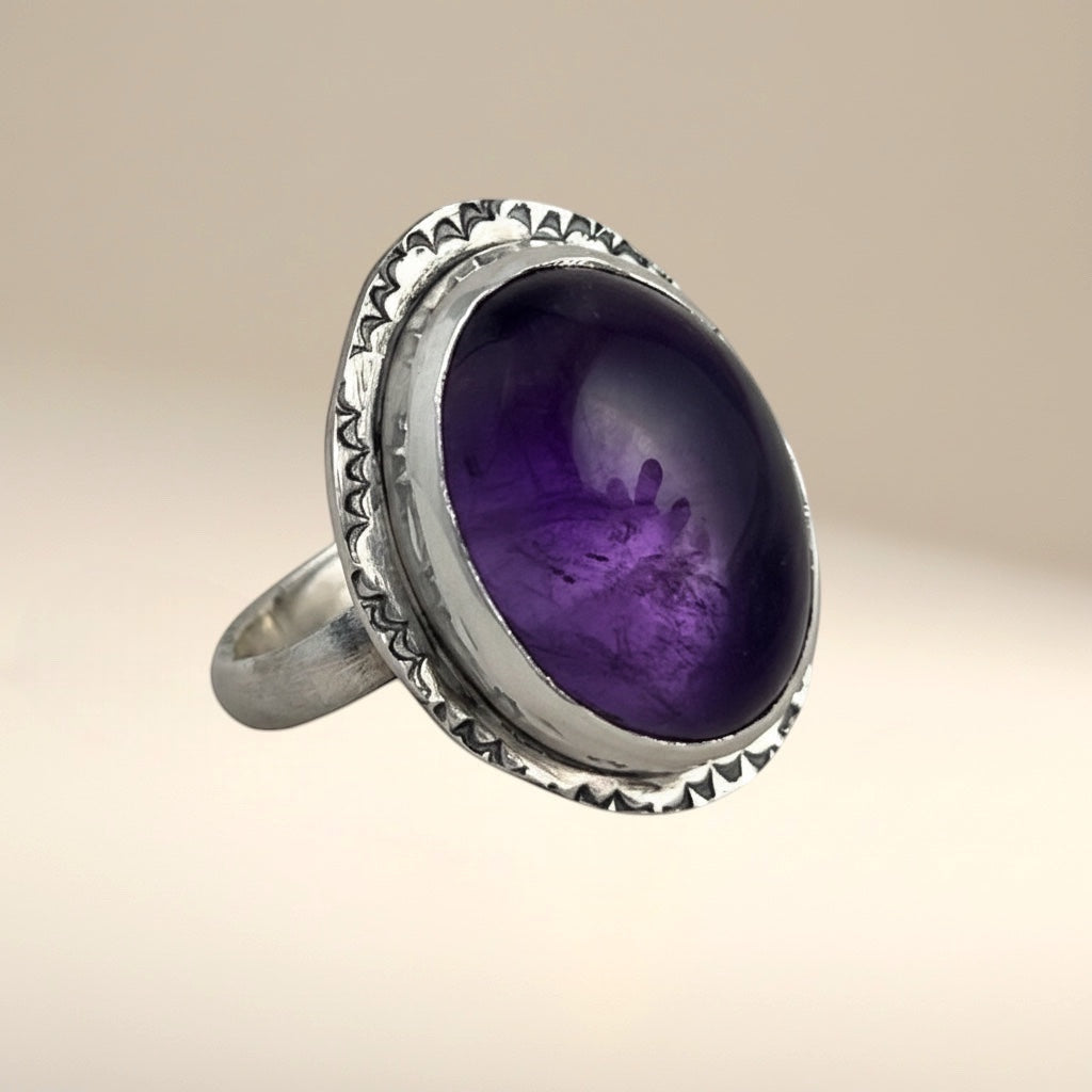 Bedrock Rose oval amethyst statement ring in sterling silver with a textured bezel and band. Size 8.