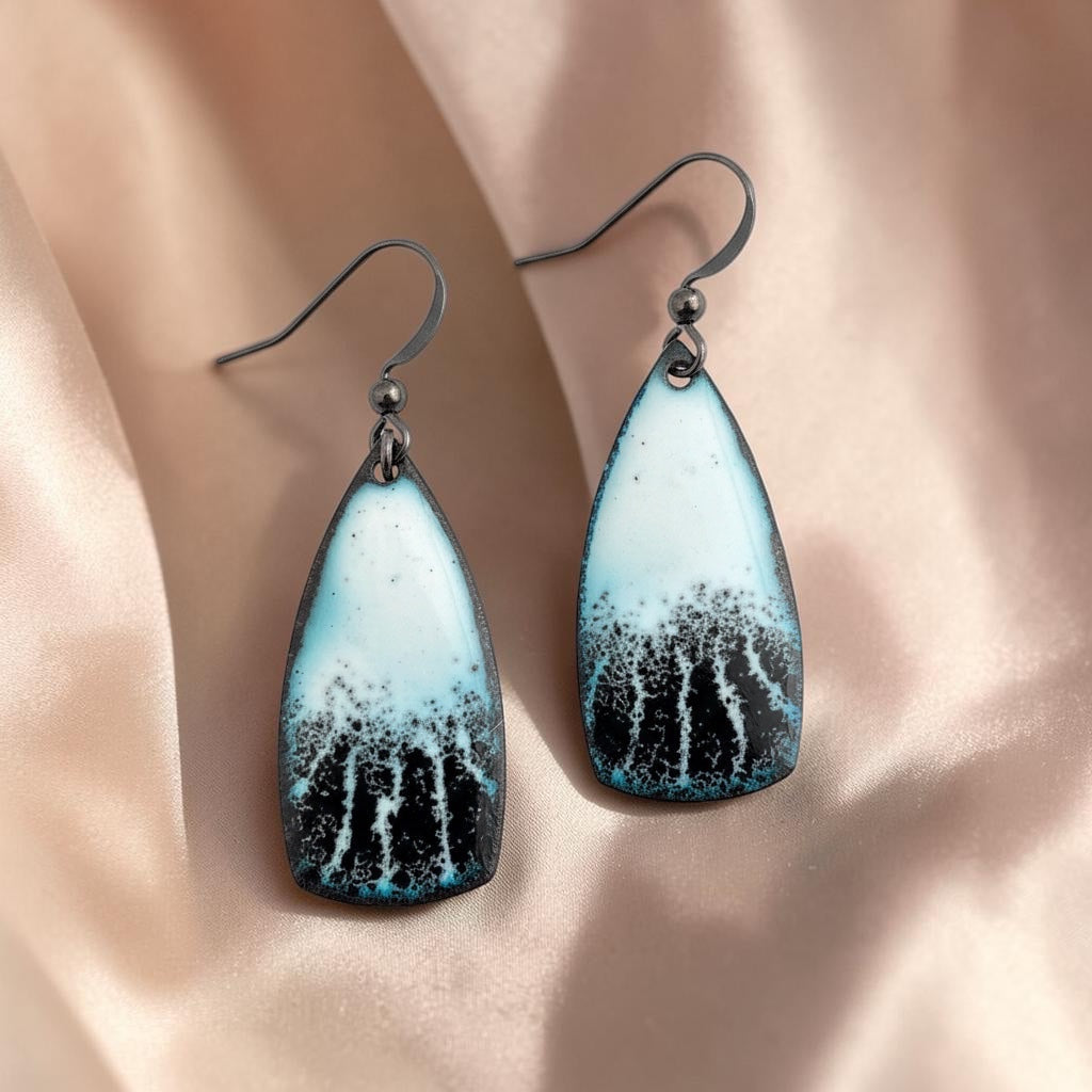 Bedrock Rose black and white enamel teardrop dangle earrings with black framing and hook backs.