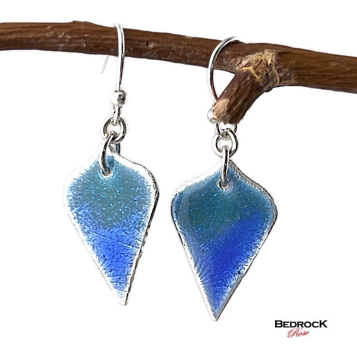 Bedrock Rose blue and green arabesque enamel dangle earrings with silver trim and surgical steel ear wires.