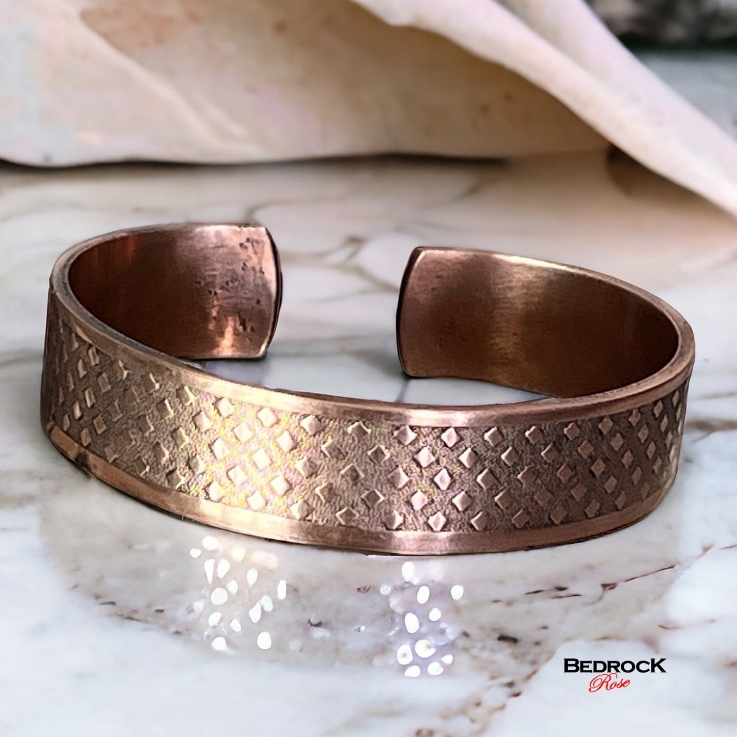 Bedrock Rose copper cuff bracelet with ombre diamond texture. Open cuff design, versatile for casual or formal wear.