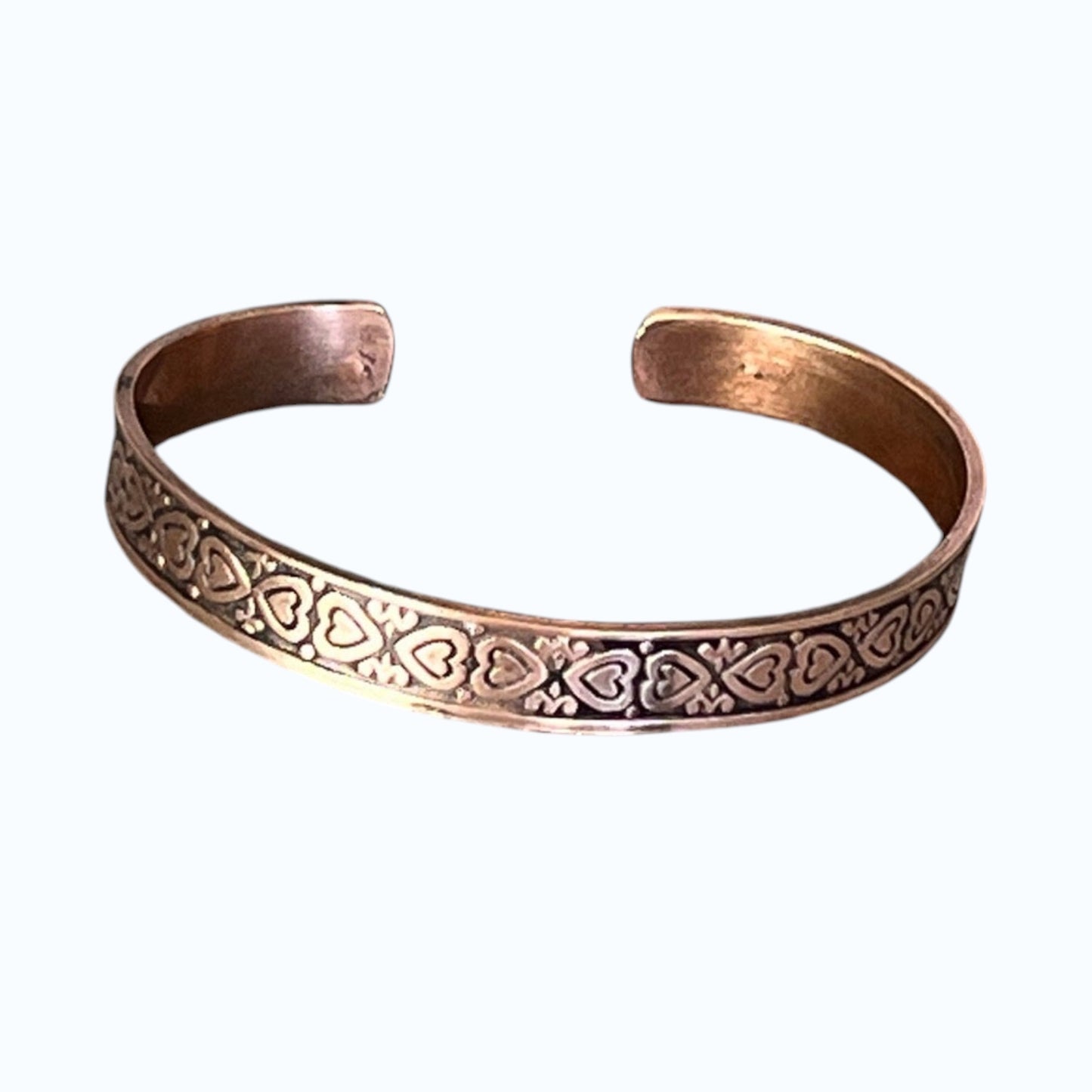 Bedrock Rose copper cuff bracelet with heart pattern design and antiqued finish.