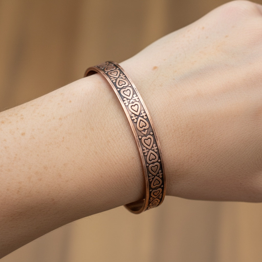 Bedrock Rose copper cuff bracelet with heart pattern design and antiqued finish.