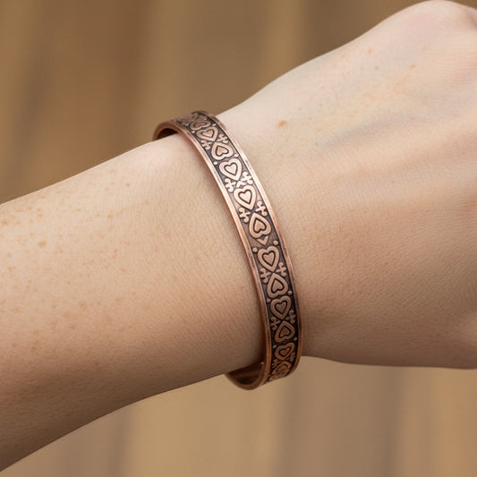 Bedrock Rose copper cuff bracelet with heart pattern design and antiqued finish.