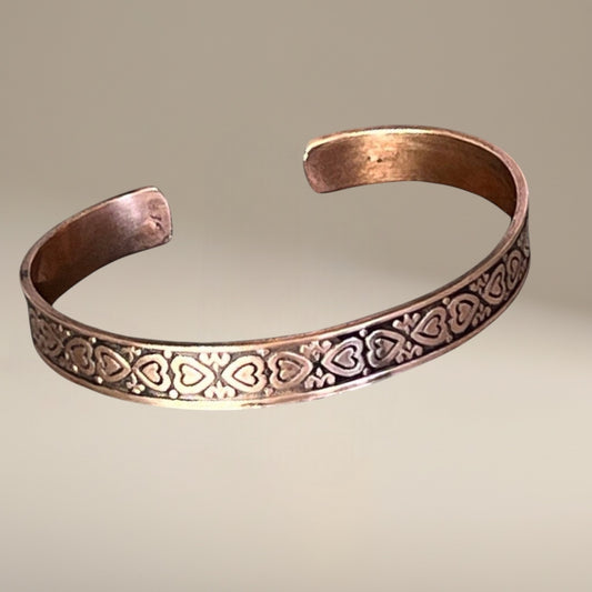 Bedrock Rose copper cuff bracelet with heart pattern design and antiqued finish.