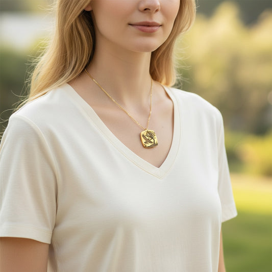 Bedrock Rose gold-plated brass necklace with laser-engraved crow, tree, and moon design. Hypoallergenic chain.