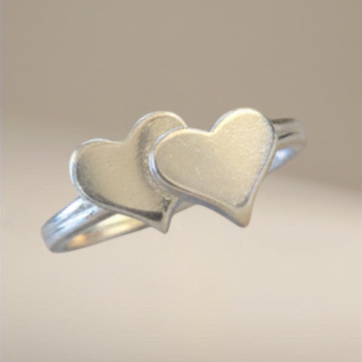 Bedrock Rose sterling silver double heart bypass ring, size 7.5. Tool and die struck for superior density and mirror finish.