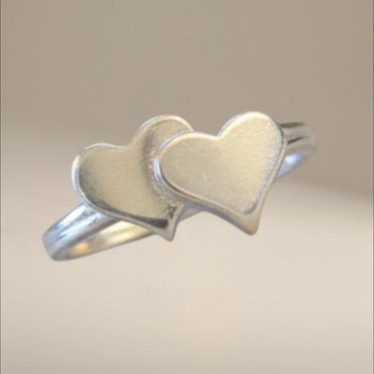 Bedrock Rose sterling silver double heart bypass ring, size 7.5. Tool and die struck for superior density and mirror finish.