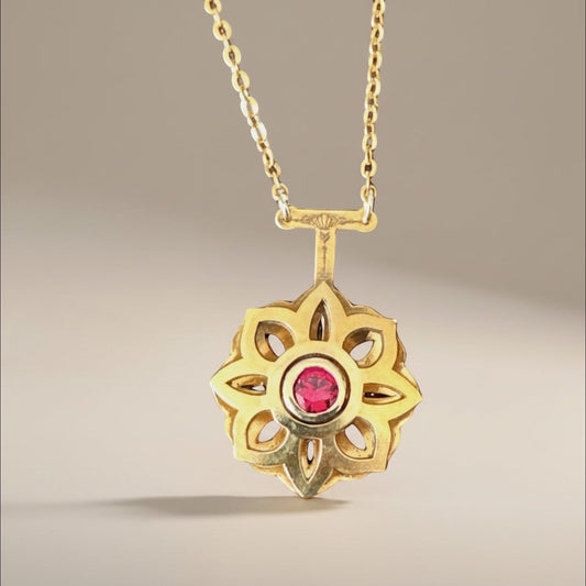 Bedrock Rose gold Art Deco floral pendant necklace with a central ruby and delicate chain.