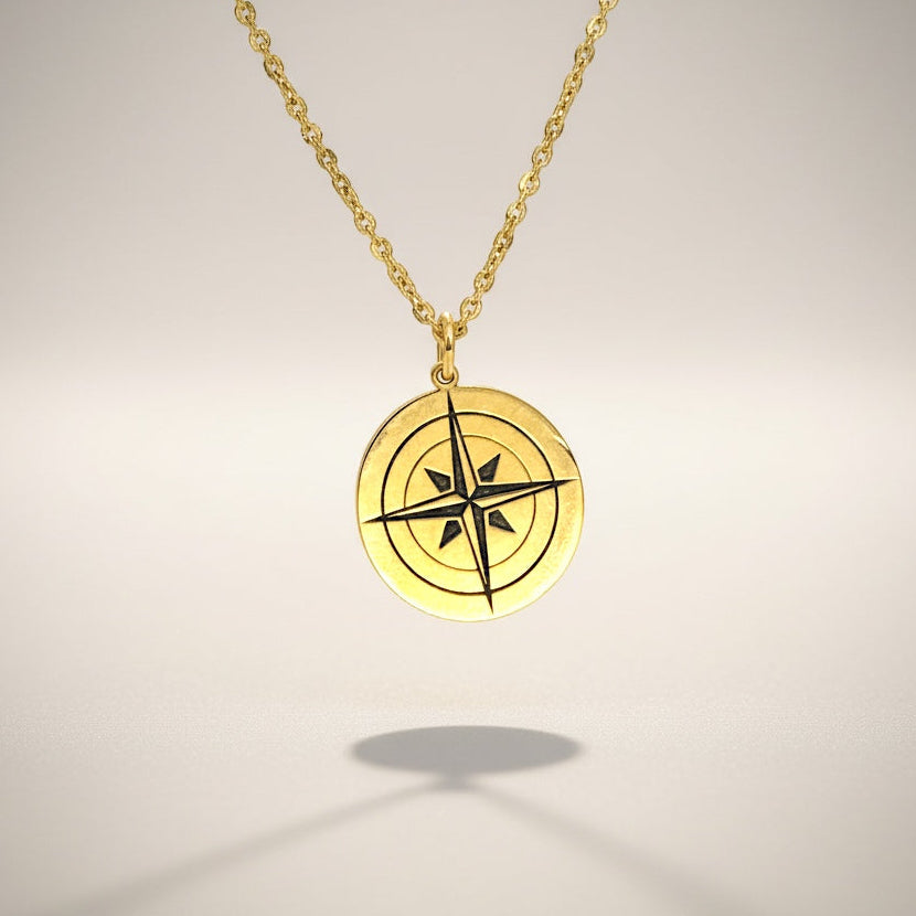 Bedrock Rose gold compass rose pendant necklace with a faceted chain. Symbol of purpose and self-discovery.