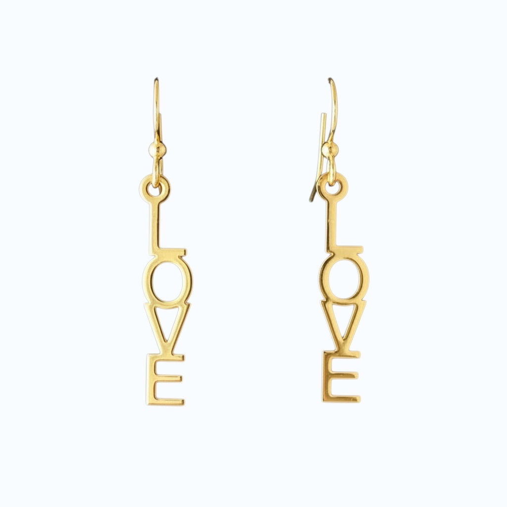 Bedrock Rose gold-plated dangling earrings with laser-cut out word "Love" in block letters. Surgical steel earwires.