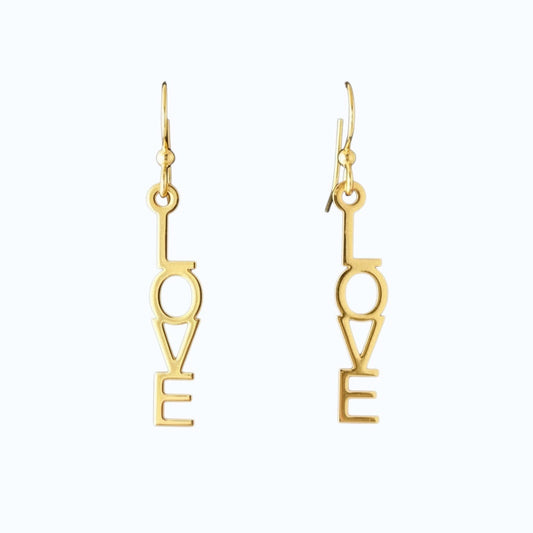 Bedrock Rose gold-plated dangling earrings with laser-cut out word "Love" in block letters. Surgical steel earwires.